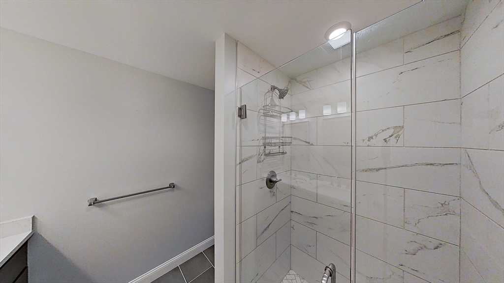 635 Old Post Road, Unit 204 Sharon, MA 02067 - Photo 9 of 22 a bathroom with a shower