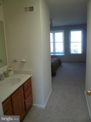 1705 Whisperhill Drive Reston, VA 20194 - Photo 5 of 17 Separate vanity in Dressing Area