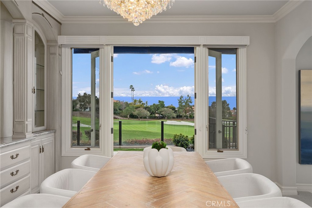 39 Marbella Dana Point, CA 92629 - Photo 12 of 58 a living room with furniture and a floor to ceiling window