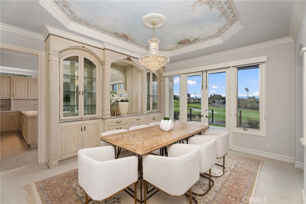 39 Marbella Dana Point, CA 92629 - Photo 13 of 58 a view of a dining room with furniture wooden floor and chandelier