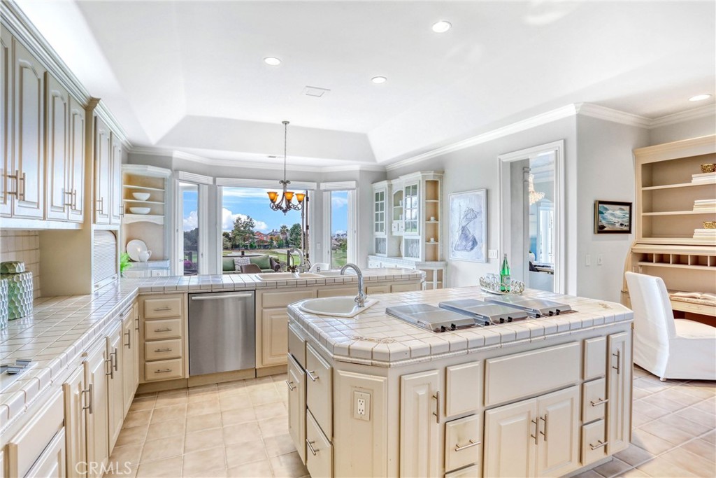 39 Marbella Dana Point, CA 92629 - Photo 15 of 58 a kitchen with sink stove and cabinets