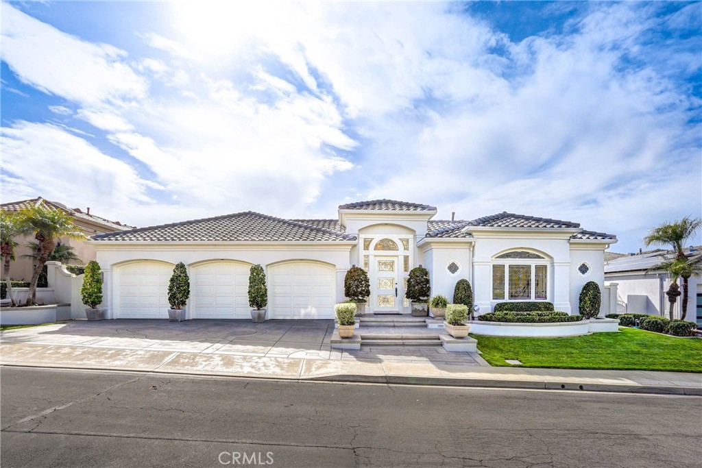 39 Marbella Dana Point, CA 92629 - Photo 2 of 58 a view of white house with a big yard and plants