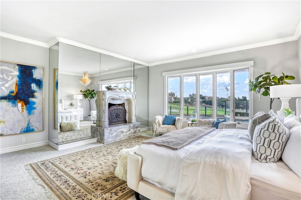 39 Marbella Dana Point, CA 92629 - Photo 25 of 58 a bedroom with a bed and large windows