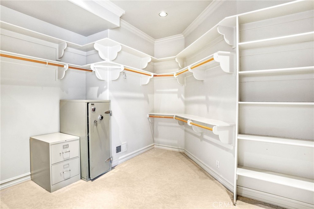 39 Marbella Dana Point, CA 92629 - Photo 28 of 58 a view of walk in closet and chandelier fan