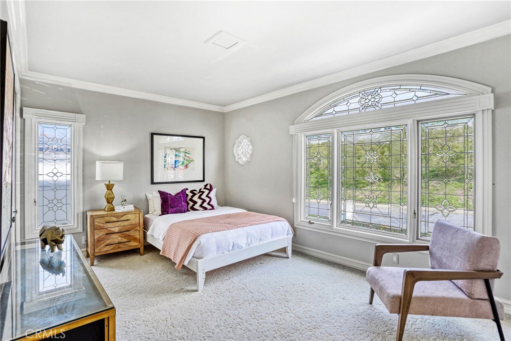 39 Marbella Dana Point, CA 92629 - Photo 29 of 58 a bedroom with a bed and a large window
