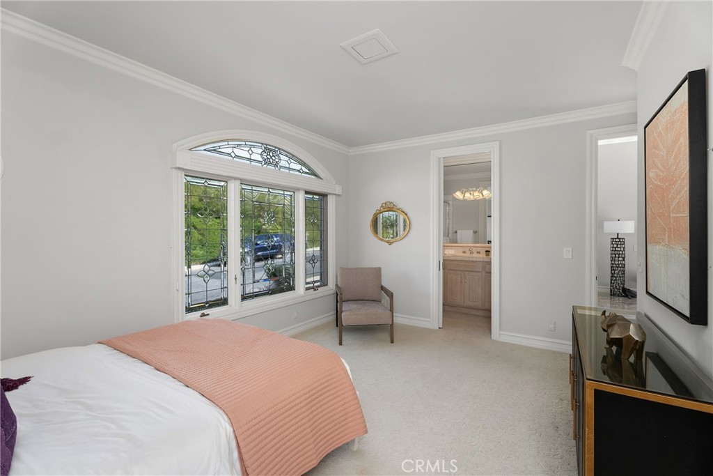 39 Marbella Dana Point, CA 92629 - Photo 30 of 58 a spacious bedroom with a bed and a window