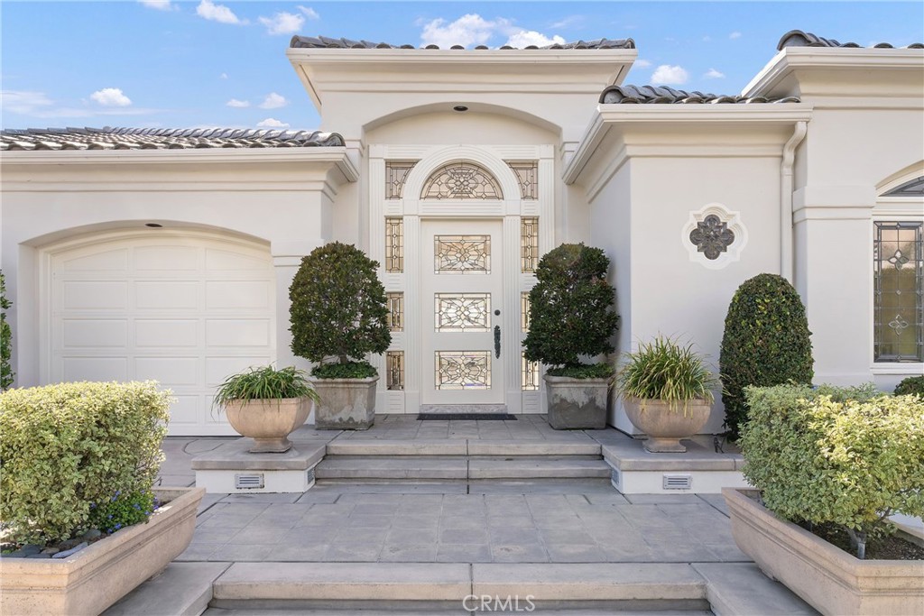 39 Marbella Dana Point, CA 92629 - Photo 3 of 58 a front view of a house with potted plants