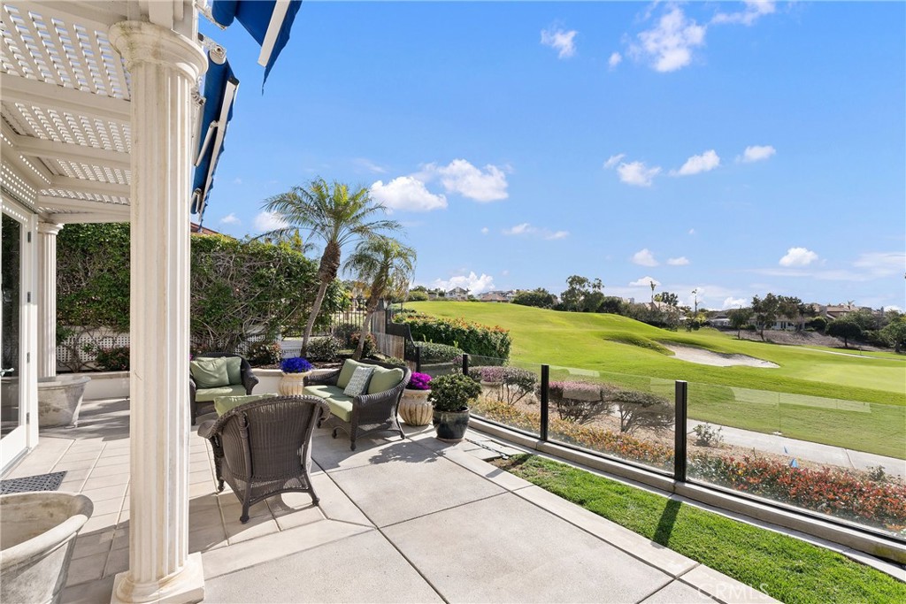 39 Marbella Dana Point, CA 92629 - Photo 38 of 58 a view of a chairs and table in patio with a garden
