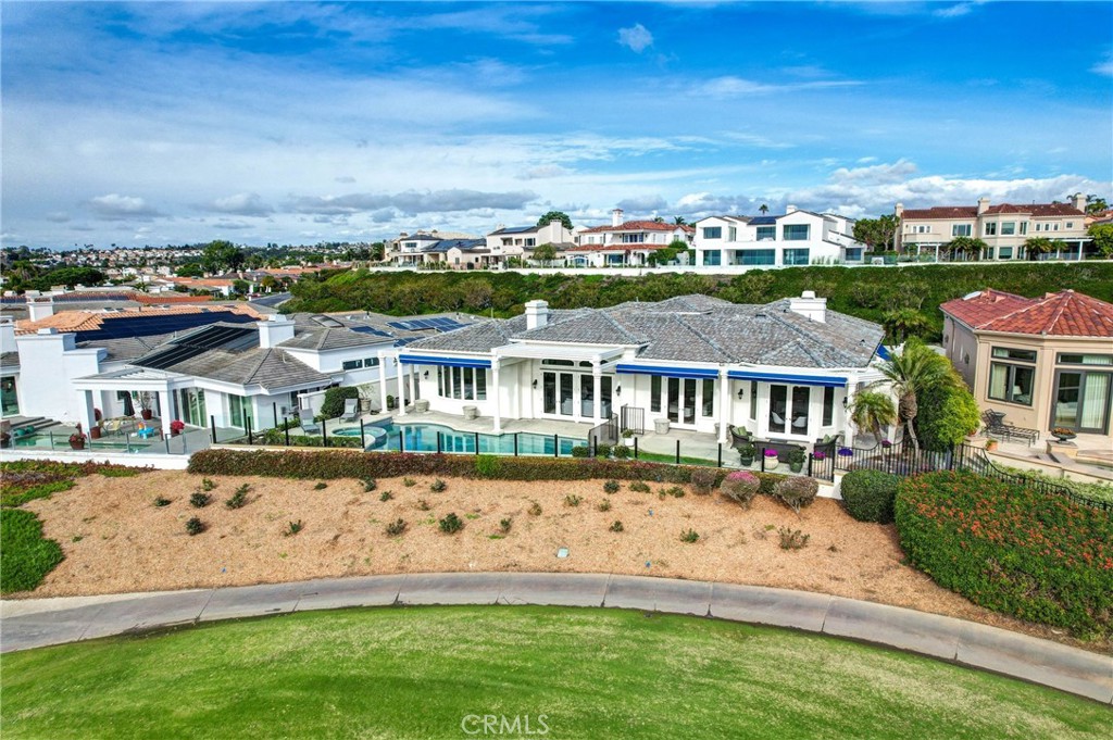 39 Marbella Dana Point, CA 92629 - Photo 45 of 58 a front view of a house with a garden