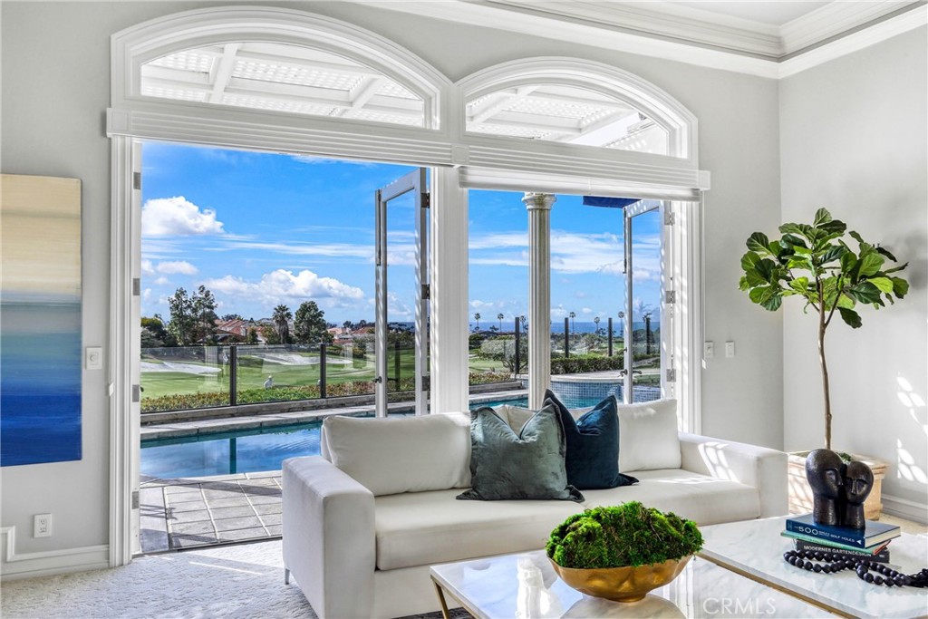 39 Marbella Dana Point, CA 92629 - Photo 8 of 58 a living room with furniture and a floor to ceiling window