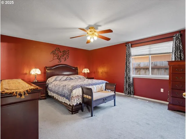 a bedroom with a bed and window