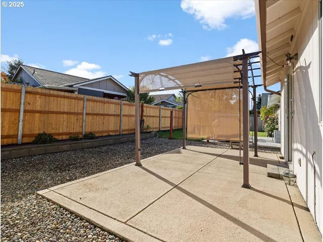 a view of a house with backyard and deck