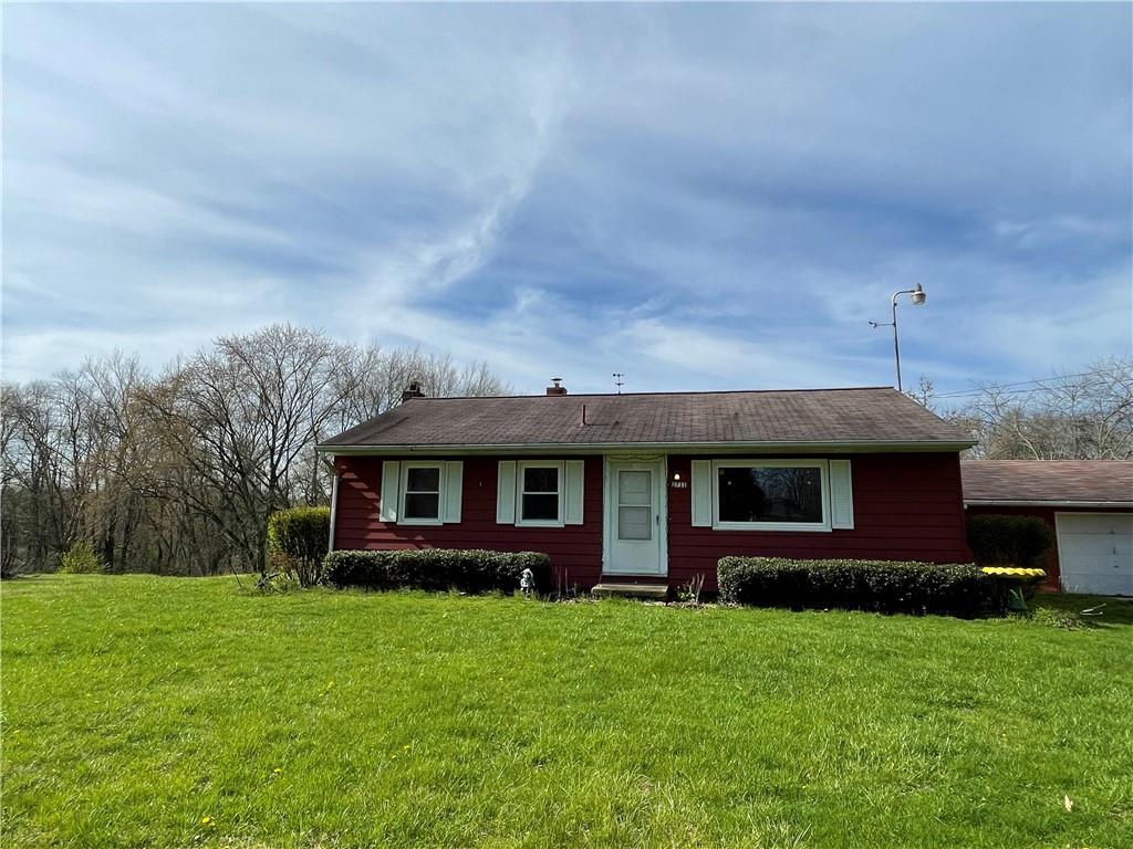 2711 Old Rte 18 Wampum, PA 16157 - Photo 1 of 23 a front view of a house with a garden