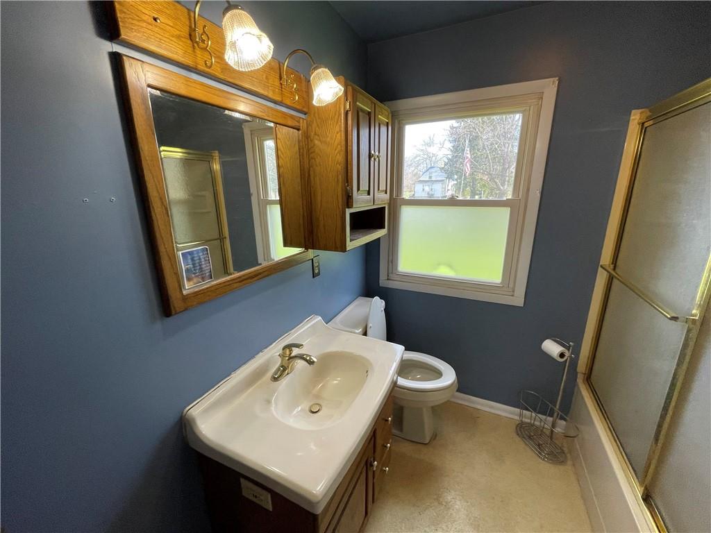 2711 Old Rte 18 Wampum, PA 16157 - Photo 11 of 23 a bathroom with a sink a toilet and mirror