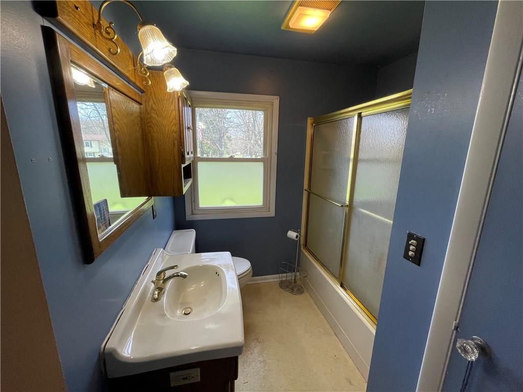 2711 Old Rte 18 Wampum, PA 16157 - Photo 12 of 23 a bathroom with a sink a toilet and a mirror