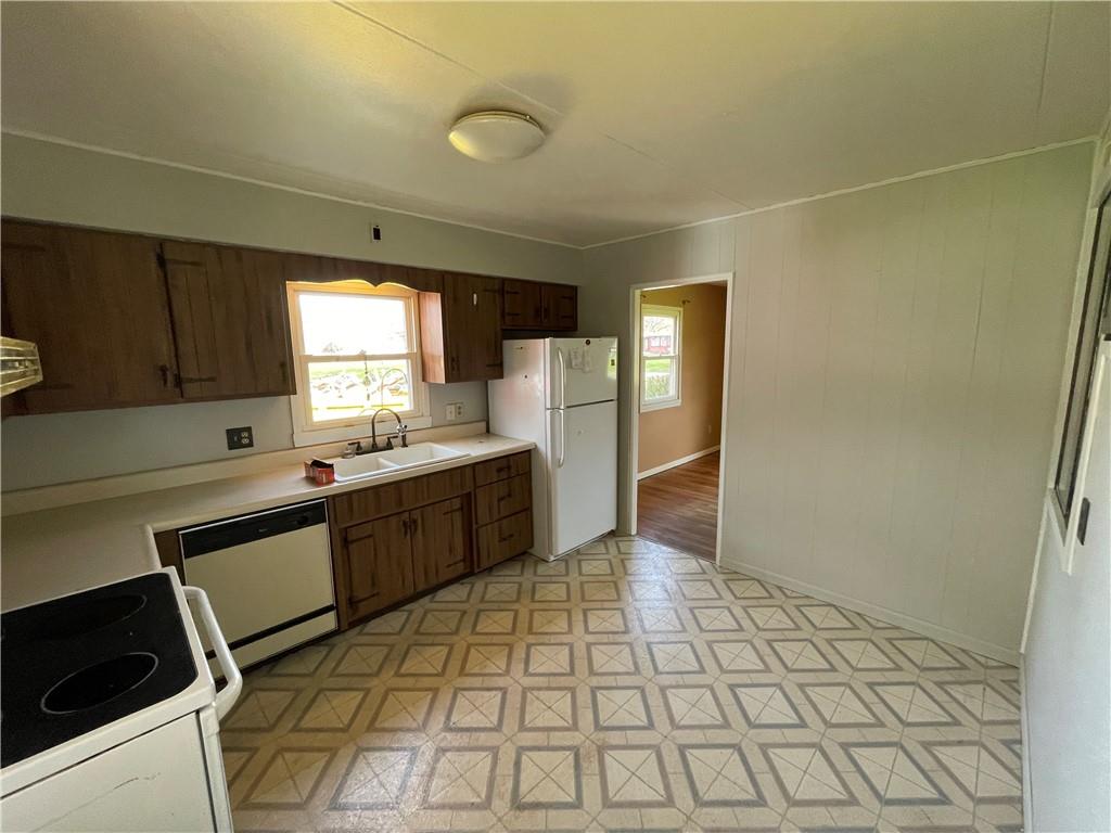 2711 Old Rte 18 Wampum, PA 16157 - Photo 2 of 23 a large kitchen with a sink and cabinets