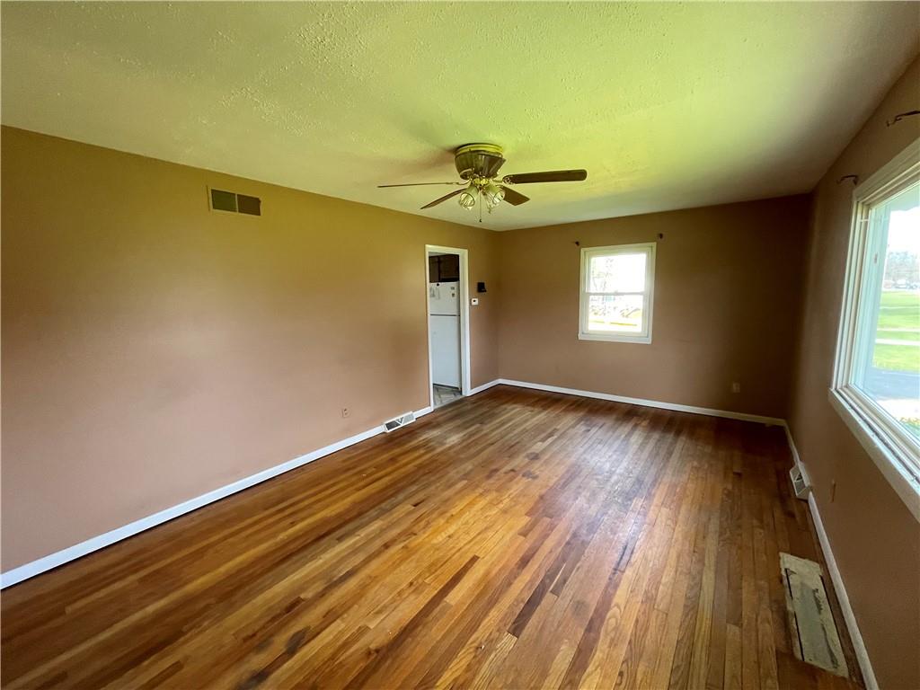 2711 Old Rte 18 Wampum, PA 16157 - Photo 7 of 23 a view of empty room with wooden floor and fan