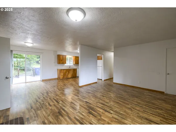 a view of an empty room and a window