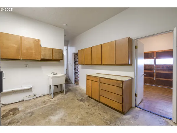a kitchen with stainless steel appliances a stove and cabinets