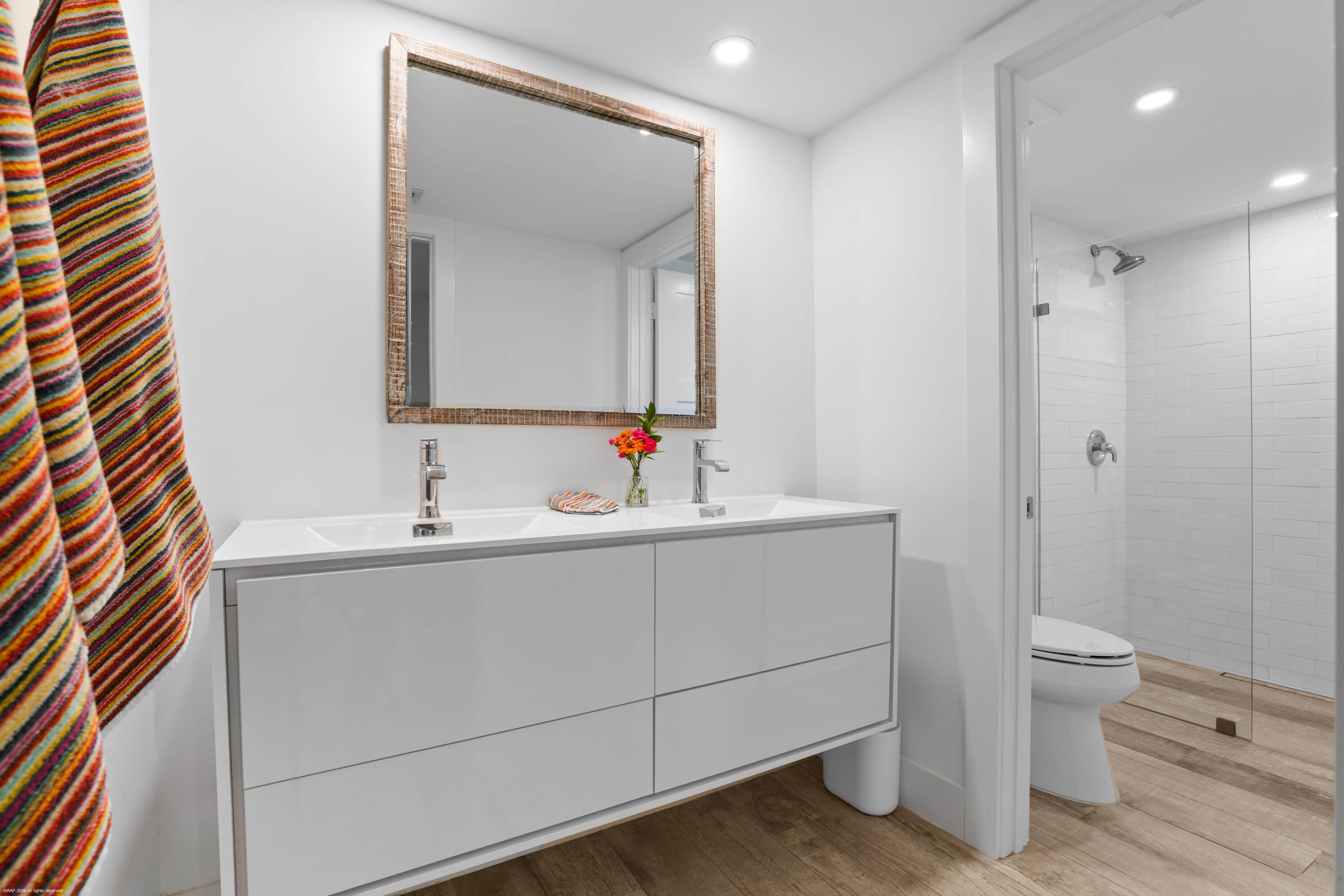 13334 Polo Club Road, Unit 234 Wellington, FL 33414 - Photo 14 of 41 a bathroom with a sink toilet and shower