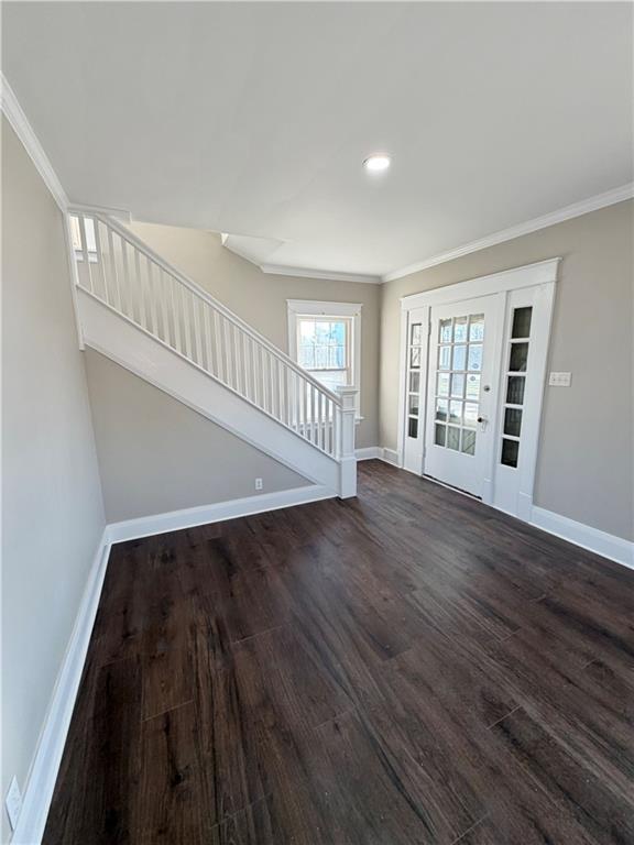 320 Reis Street New Castle, PA 16101 - Photo 2 of 28 a view of an empty room with wooden floor and a window
