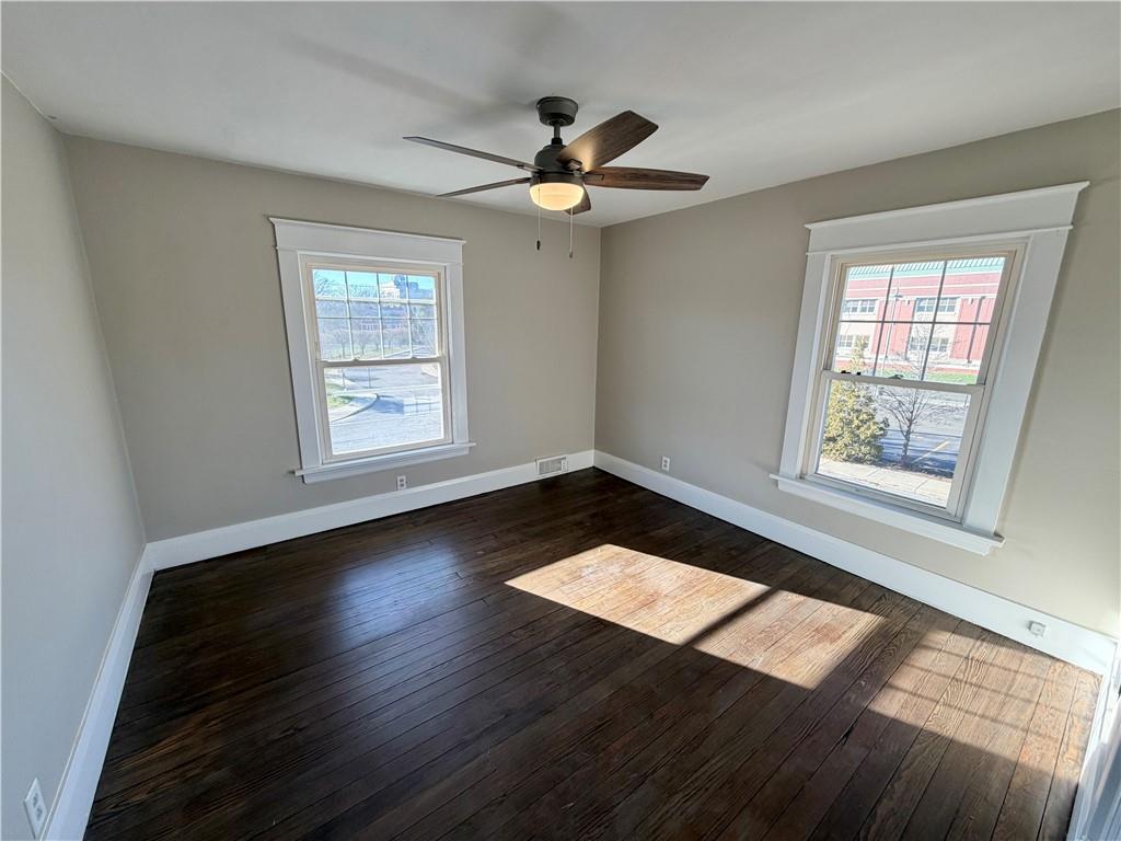 320 Reis Street New Castle, PA 16101 - Photo 21 of 28 a view of wooden floor in an empty room with a window