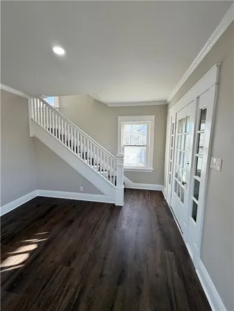 a view of an entryway with wooden floor