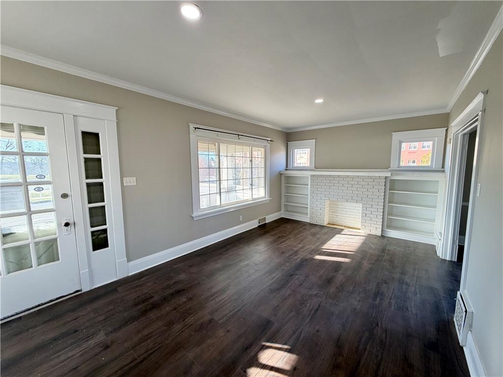 320 Reis Street New Castle, PA 16101 - Photo 4 of 28 wooden floor in an empty room with a window