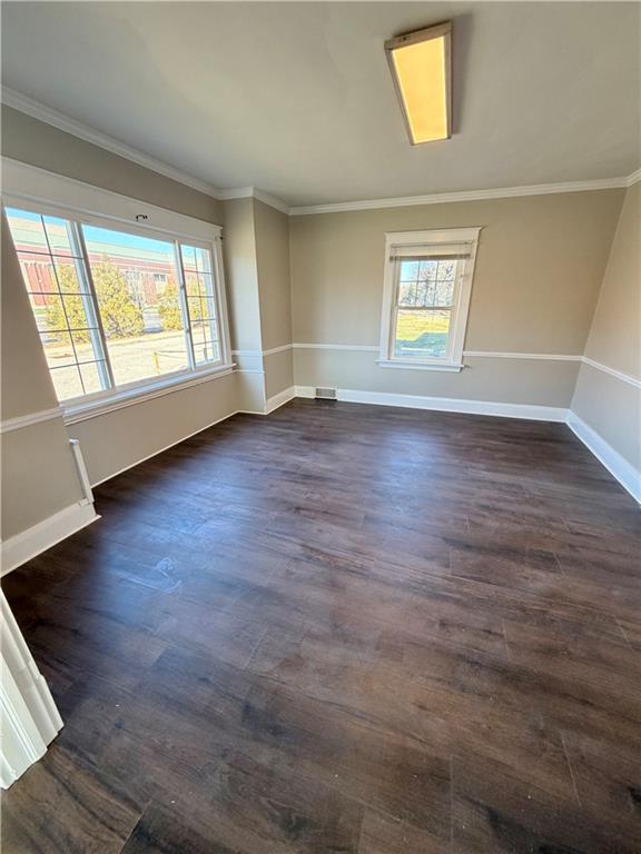 320 Reis Street New Castle, PA 16101 - Photo 6 of 28 an empty room with wooden floor and windows
