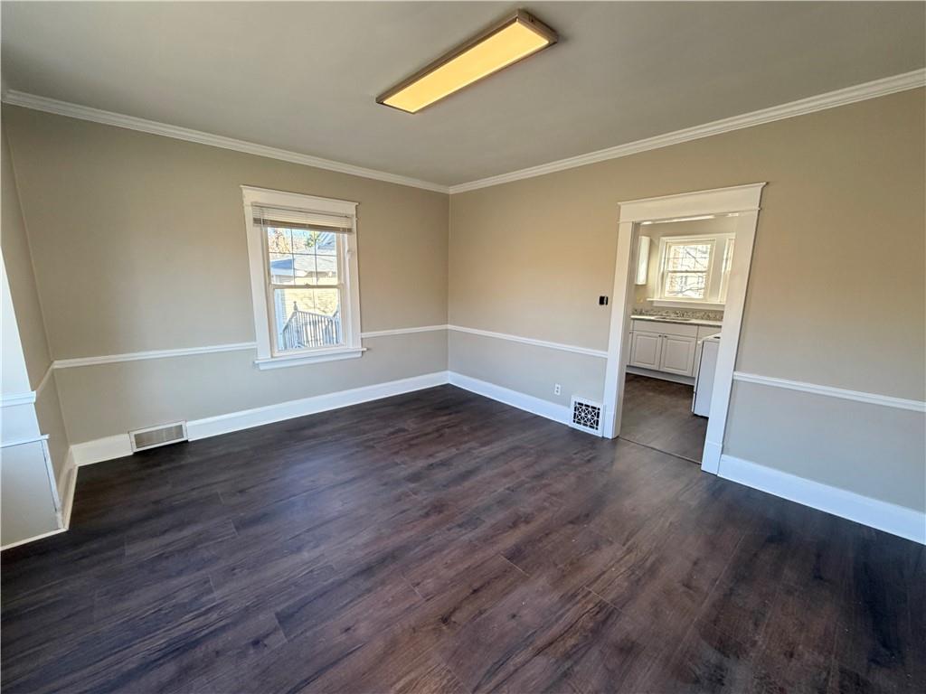 320 Reis Street New Castle, PA 16101 - Photo 7 of 28 a view of empty room with wooden floor and fan
