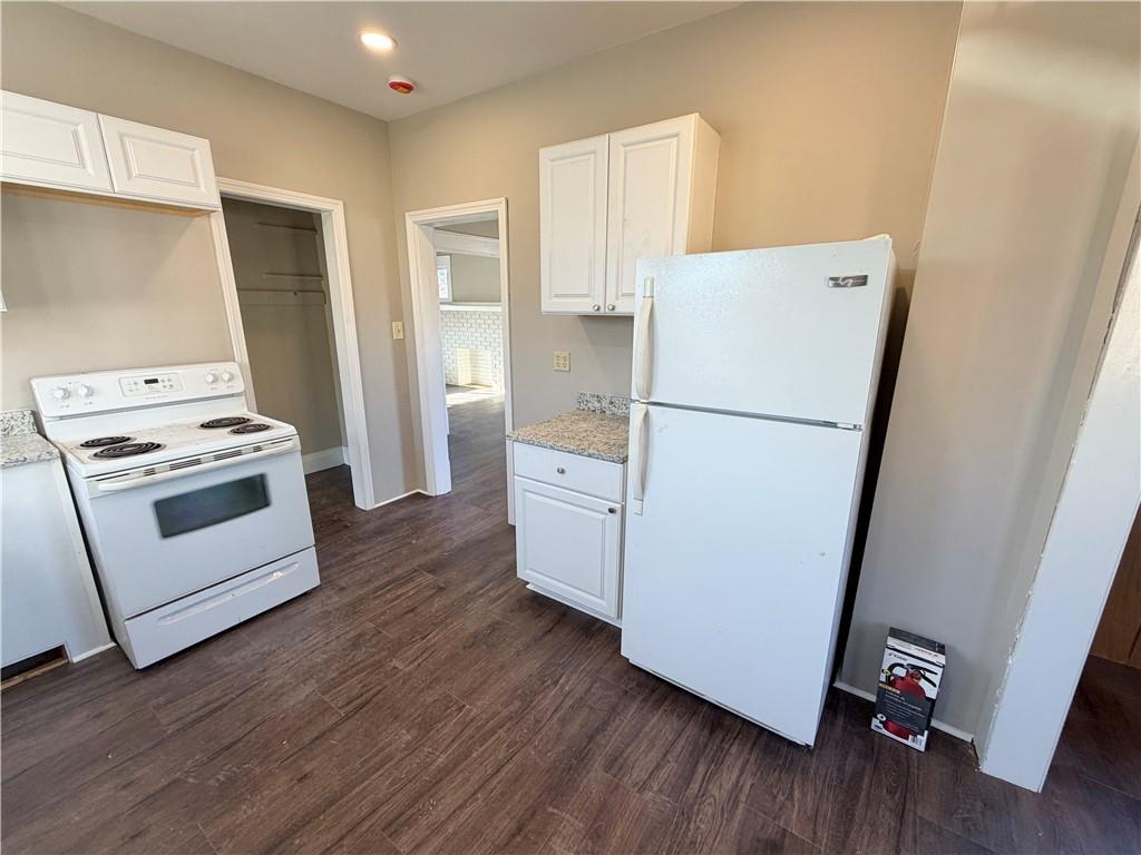 320 Reis Street New Castle, PA 16101 - Photo 10 of 28 a white refrigerator freezer and a stove sitting inside of a kitchen