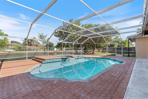 a view of a swimming pool with a patio