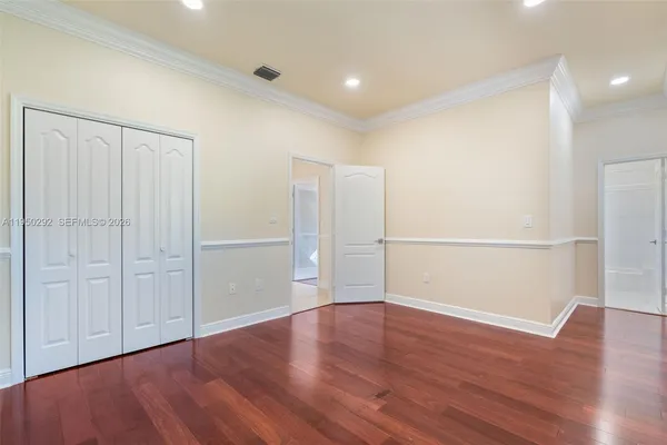 an empty room with wooden floor