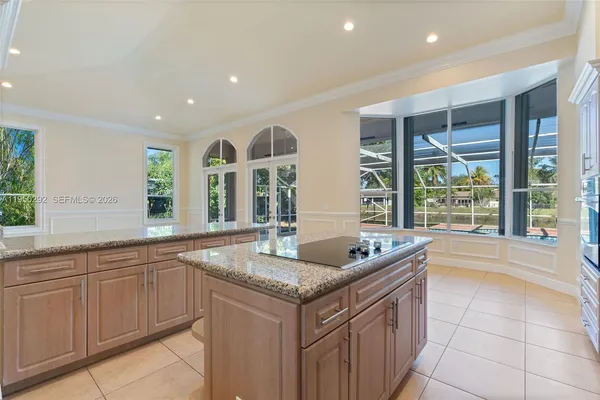 a kitchen with granite countertop a sink and dishwasher a oven with granite countertops