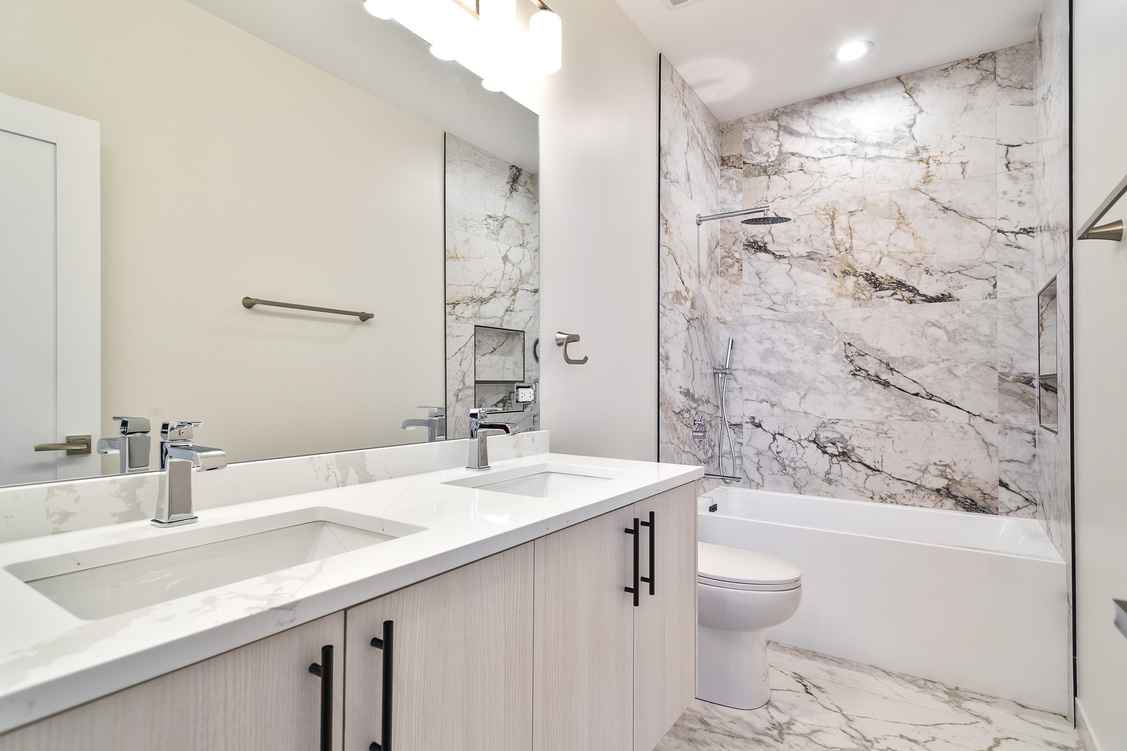 3013 North Normandy Avenue Chicago, IL 60634 - Photo 13 of 26 a bathroom with a sink a toilet and shower