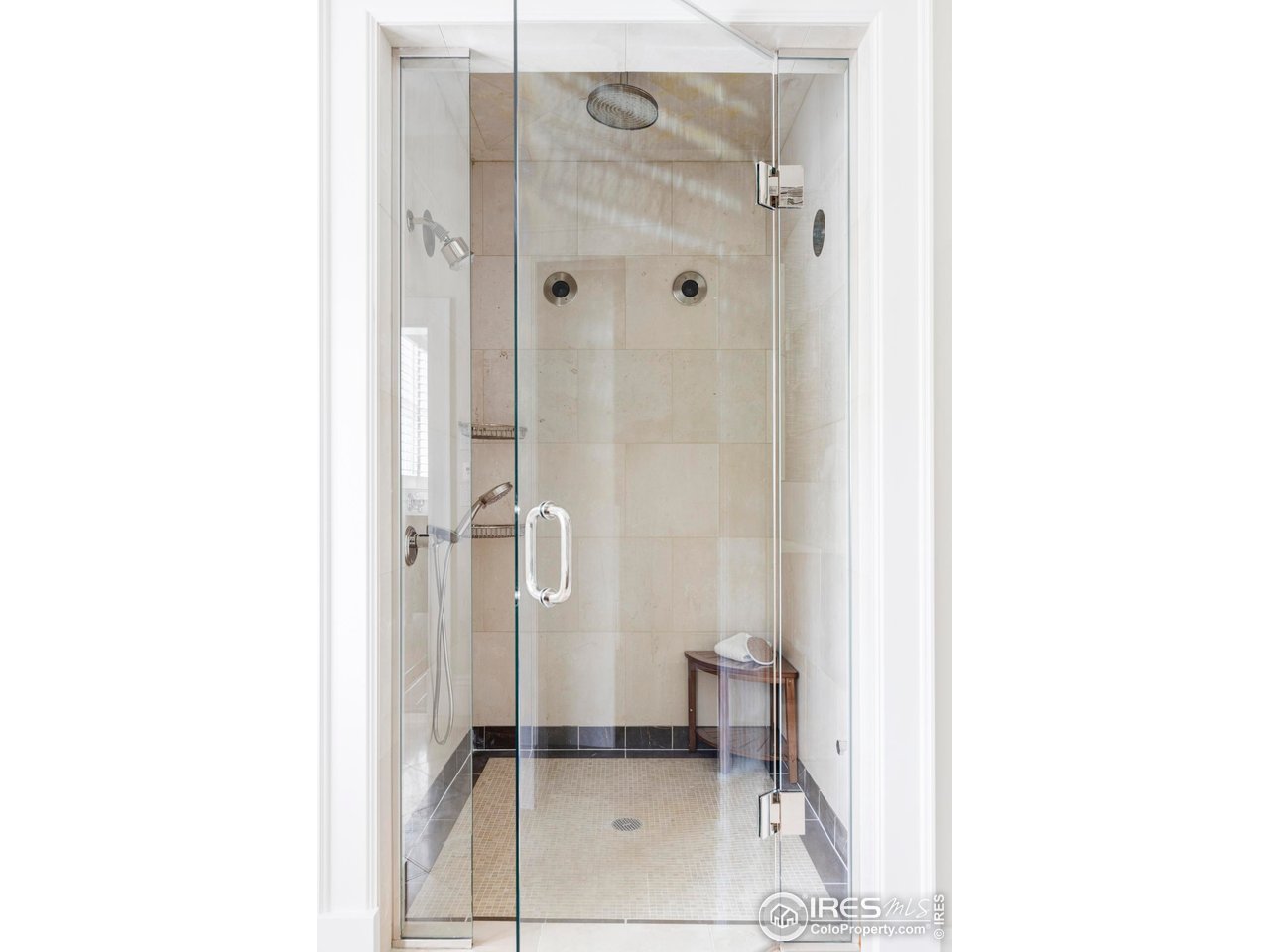 3189 5th Street Boulder, CO 80304 - Photo 17 of 37 a bathroom with a glass shower door