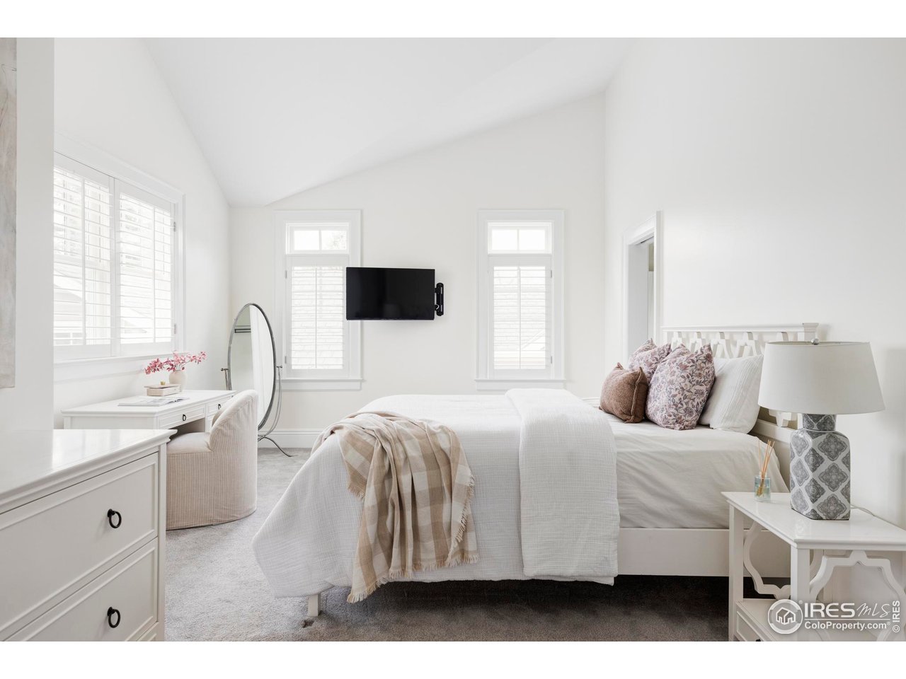 3189 5th Street Boulder, CO 80304 - Photo 21 of 37 a bedroom with a bed and a flat screen tv