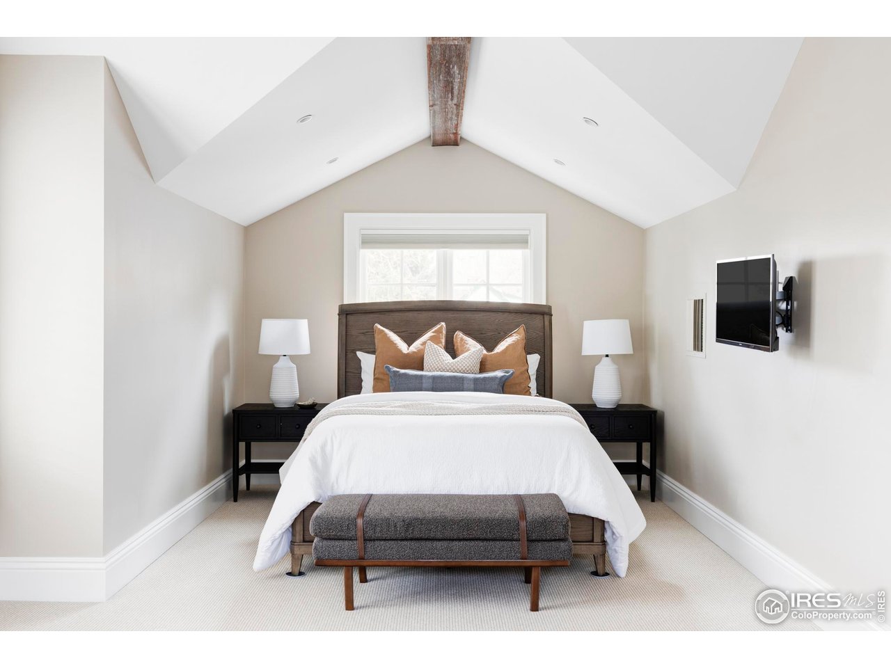 3189 5th Street Boulder, CO 80304 - Photo 30 of 37 a bedroom with a bed a tv and wooden floor