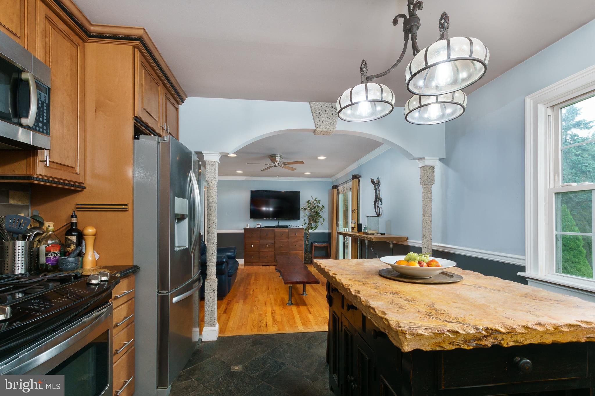 50 Skillman Road Skillman, NJ 08558 - Photo 11 of 31 a view of a dining room with furniture a kitchen and chandelier