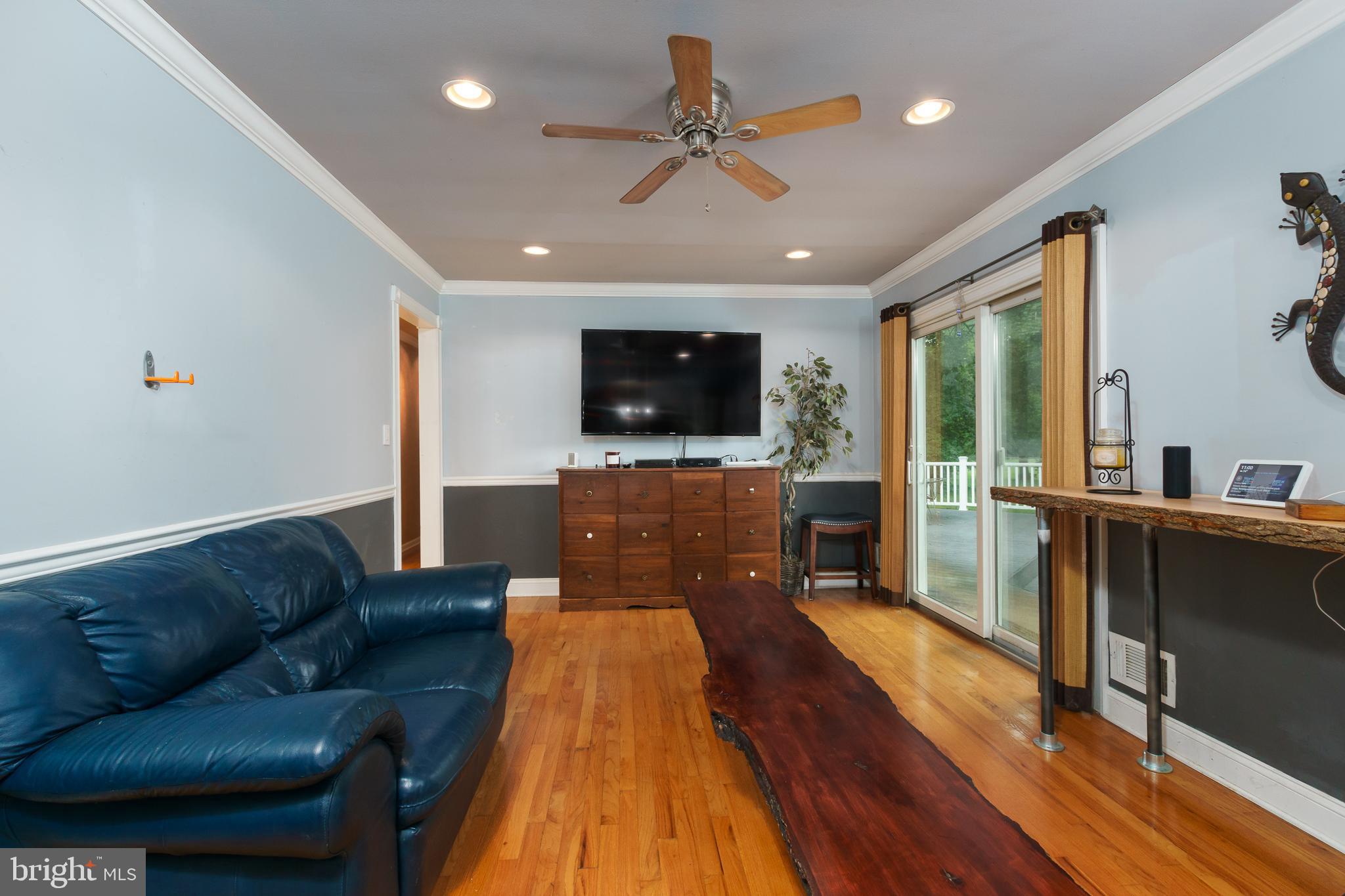 50 Skillman Road Skillman, NJ 08558 - Photo 12 of 31 a living room with furniture and a flat screen tv