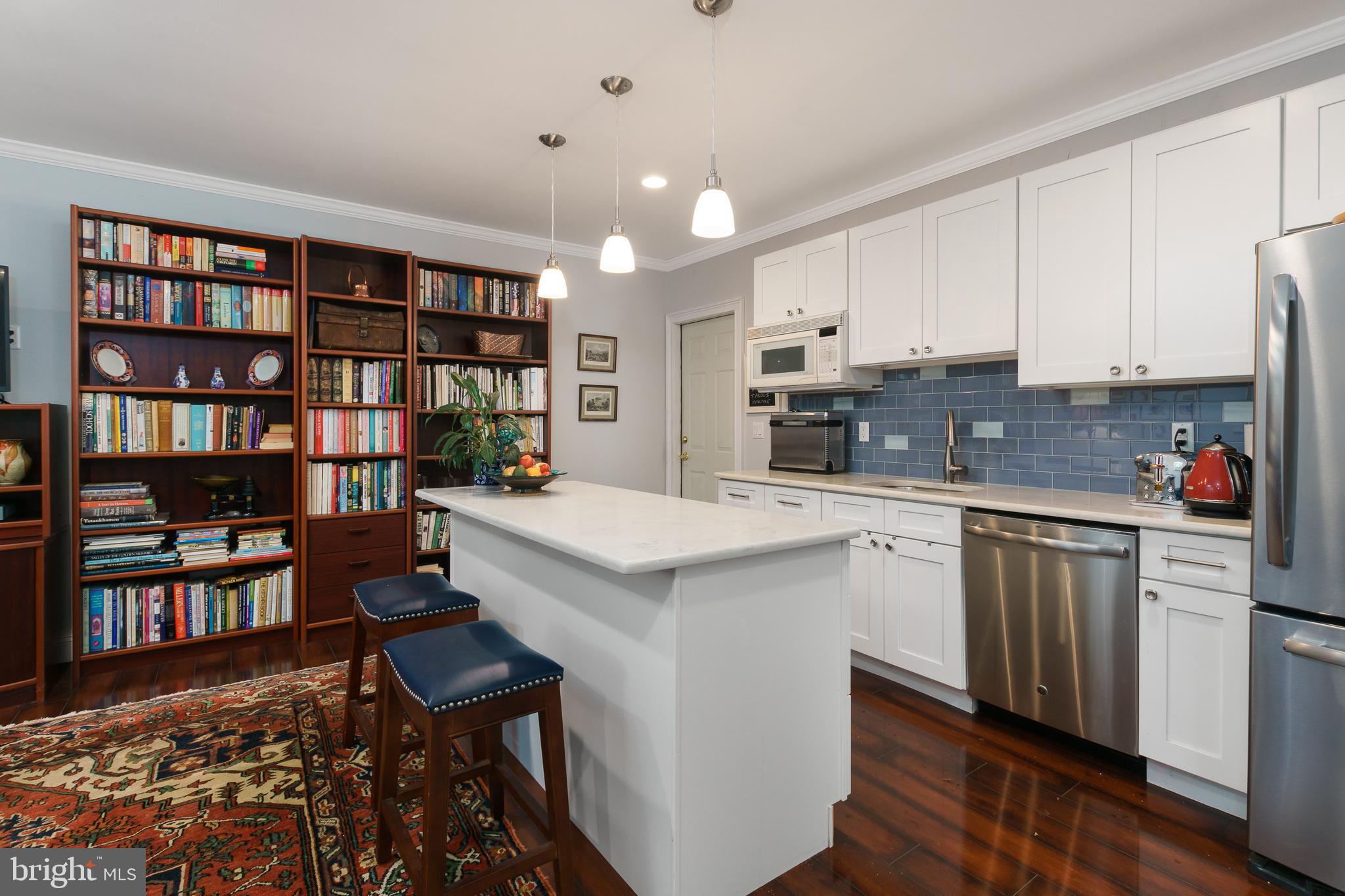 50 Skillman Road Skillman, NJ 08558 - Photo 21 of 31 a kitchen with kitchen island a stove a sink and a refrigerator