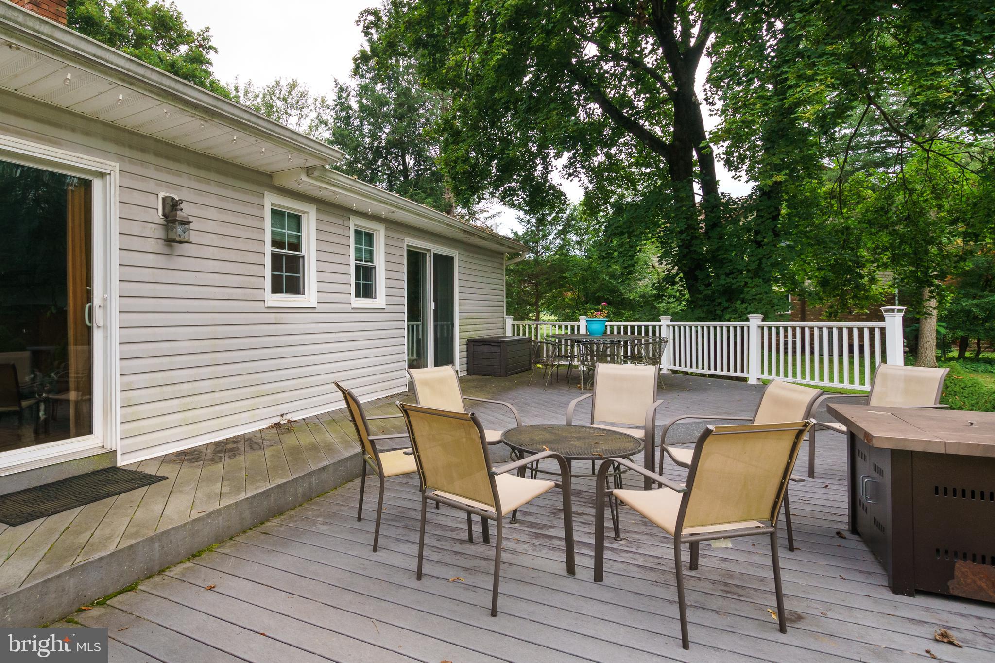 50 Skillman Road Skillman, NJ 08558 - Photo 28 of 31 a view of a deck with table and chairs and wooden floor
