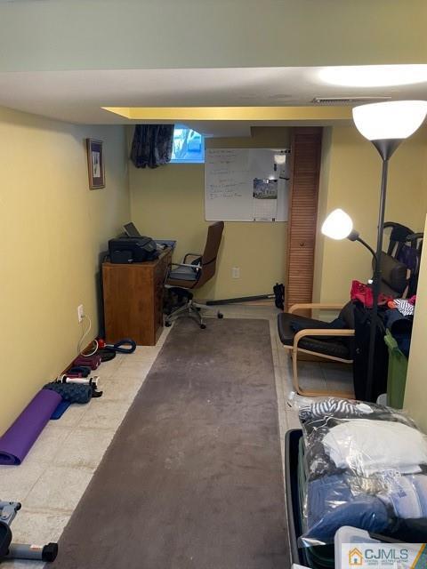 5 Bowser Road New Brunswick, NJ 08901 - Photo 44 of 45 a living room with furniture gym equipment and a table