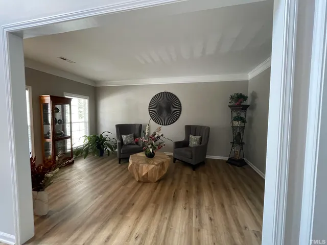 a en suite bathroom with a sink double vanity and a mirror