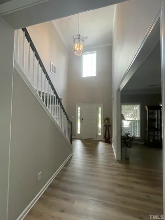 a view of a dining room with furniture and window