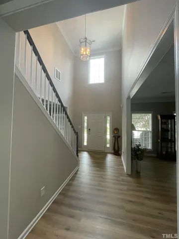 a view of a dining room with furniture and window