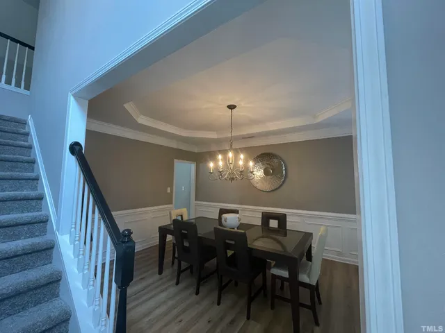 a kitchen with refrigerator a microwave and wooden cabinets