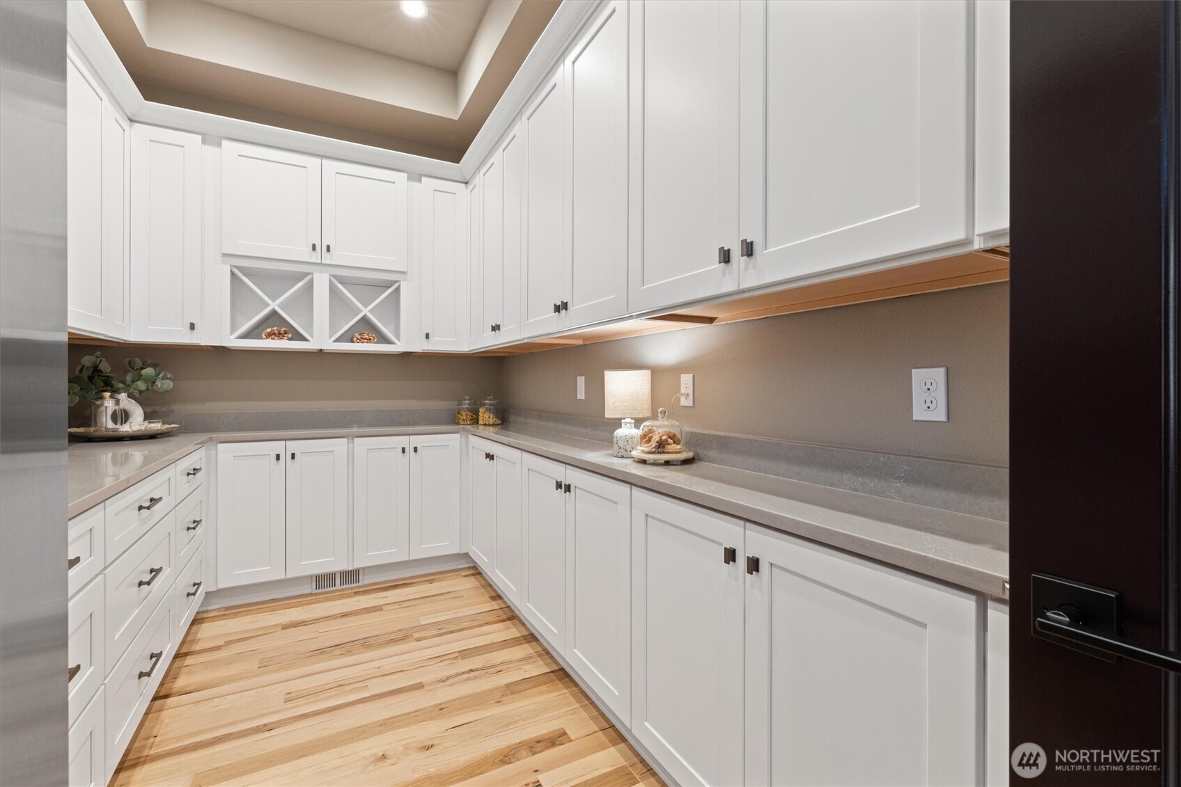 151 East Windy Ridge Lane Belfair, WA 98528 - Photo 13 of 40 a kitchen with granite countertop white cabinets and white appliances
