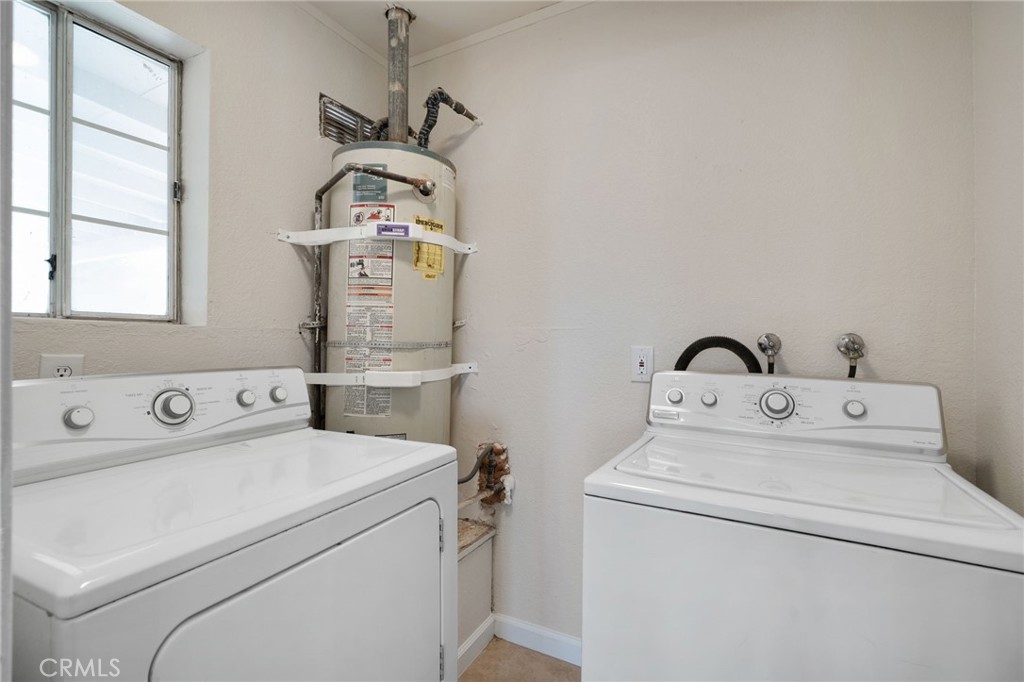 9846 Sunny Vista Road Phelan, CA 92371 - Photo 13 of 34 a utility room with dryer and washer
