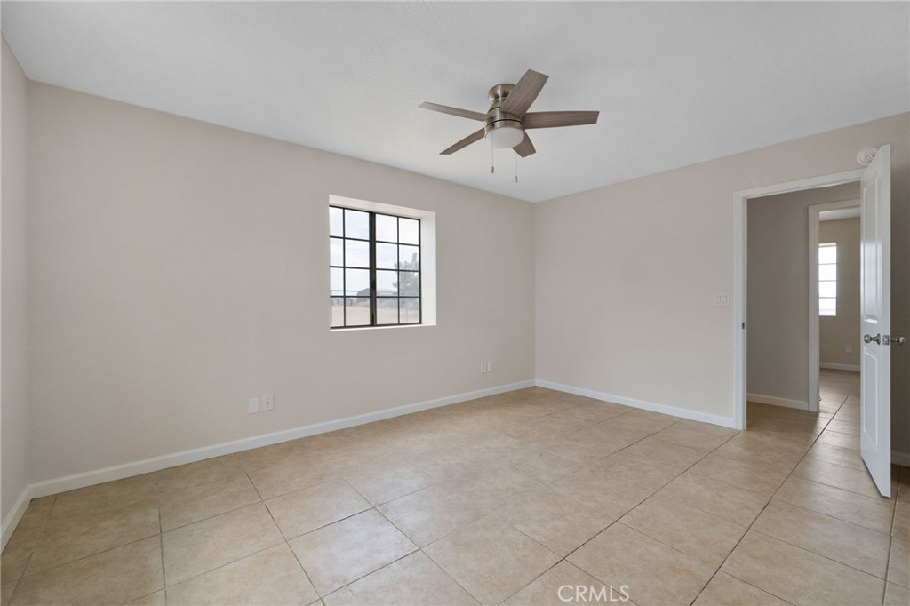 9846 Sunny Vista Road Phelan, CA 92371 - Photo 16 of 34 a view of an empty room with a window